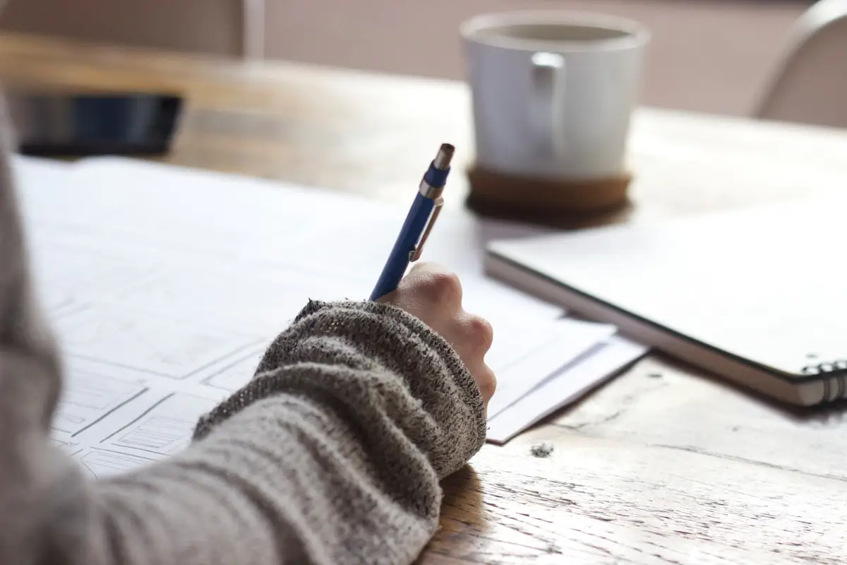 Writer developing content ideas and notes at a desk